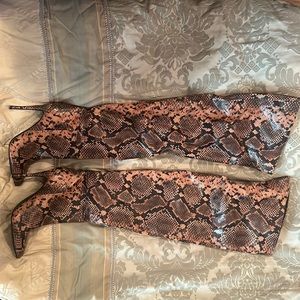 Thigh high snake boots